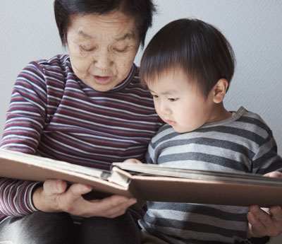 Grandmother reading to grandson